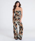 Pair the Tropical Breeze Strapless Wide-Leg Jumpsuit with your favorite sandals or sneakers for effortless warm-weather looks with on-trend black jumpsuits that speak your style.