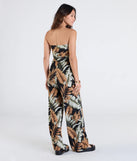 Pair the Tropical Breeze Strapless Wide-Leg Jumpsuit with your favorite sandals or sneakers for effortless warm-weather looks with on-trend black jumpsuits that speak your style.