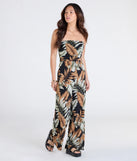 Pair the Tropical Breeze Strapless Wide-Leg Jumpsuit with your favorite sandals or sneakers for effortless warm-weather looks with on-trend black jumpsuits that speak your style.