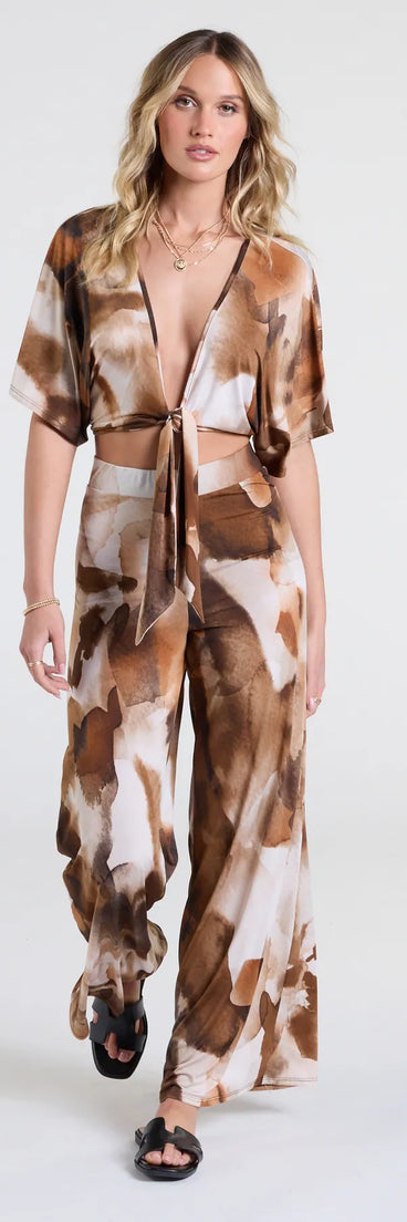 Serve effortless style and scroll-stopping energy in the Off To Paradise Wide-Leg Abstract Pants, part of a brown matching clothing set that does the work for you with bold, polished vibes from top to bottom.