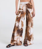 Pair the  Off To Paradise Wide-Leg Abstract Pants with your favorite crop or bodysuit for effortless warm-weather looks with on-trend brown pants that speak your style.