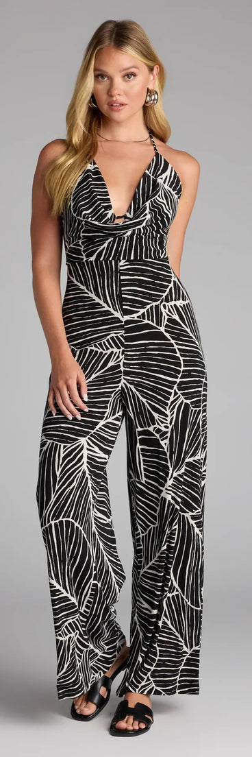Style up your rotation with the Tropic Like It’s Hot Wide Leg Cowl Neck Jumpsuit, a trendy black jumpsuit made to anchor every outfit with attitude and ease.