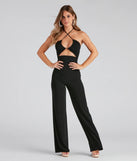 The Sleek And Sultry Halter Jumpsuit in black is a women's jumpsuit with an on-trend leg style and elevated fabric that adds texture, perfect for crafting effortless spring outfits.