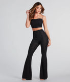 The Dose Of Glitter High-Rise Flare Pants is a trendy women's bottom in black, designed with modern details and alluring textures to complete chic outfits for 2025.