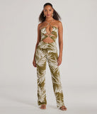 The Jet-Set to Paradise Strappy Cutout Tropical Knit Jumpsuit in olive is a women's jumpsuit with an on-trend leg style and elevated fabric that adds texture, perfect for crafting effortless winter outfits.