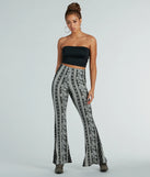 The Free Spirit Chick High-Rise Boho Flare Pants in black is a pair of women's pants with an on-trend leg style and elevated fabric that adds texture, perfect for crafting effortless winter outfits.