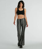 The To The Sky Boho V-Waist Tie Flare Pants in black is a pair of women's pants with an on-trend leg style and elevated fabric that adds texture, perfect for crafting effortless winter outfits.