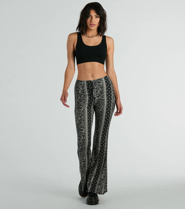 The To The Sky Boho V-Waist Tie Flare Pants in black is a pair of women's pants with an on-trend leg style and elevated fabric that adds texture, perfect for crafting effortless winter outfits.