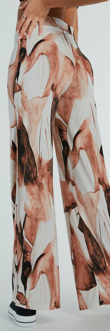 Refresh your fall closet with stylish women's pants like the Like A Work Of Art Abstract Wide Leg Palazzo Pants in a sleek fabric and a pant leg style that makes your look unique.