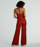 The Sunny Energy Halter Cut Out Wide Leg Jumpsuit is a trendy women's bottom in rust, designed with modern details and alluring textures to complete chic outfits for 2025.