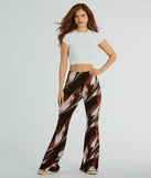 The Brush Stroke High-Rise Flare Pants in brown is a pair of women's pants with an on-trend leg style and elevated fabric that adds texture, perfect for crafting effortless winter outfits.