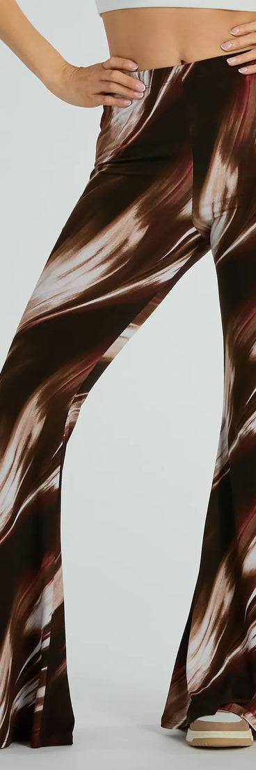 The Brush Stroke High-Rise Flare Pants in brown is a versatile pair of women's pants with trendy design accents, crafted for holiday-ready looks, from office wear to sophisticated winter night outs.