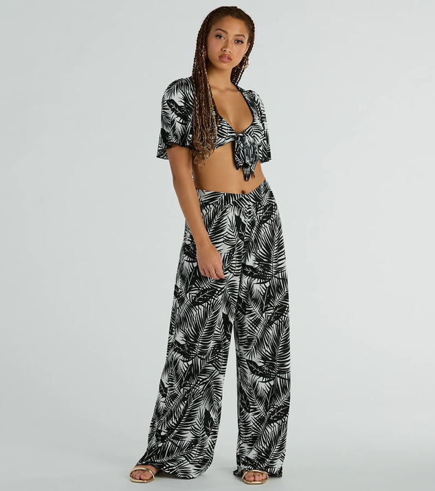 The Time For Vacay High Rise Tropical Palazzo Pants in black is a pair of women's pants with an on-trend leg style and elevated fabric that adds texture, perfect for crafting effortless winter outfits.