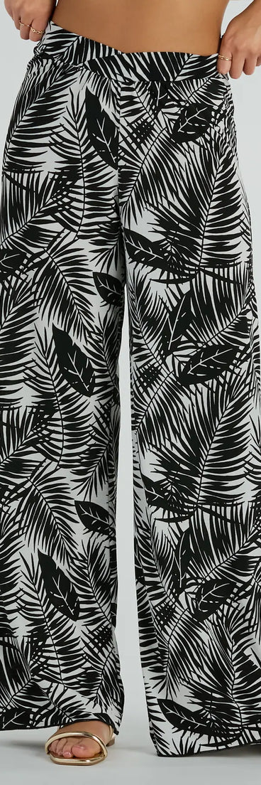 The Time For Vacay High Rise Tropical Palazzo Pants in black is a versatile pair of women's pants with trendy design accents, crafted for holiday-ready looks, from office wear to sophisticated winter night outs.