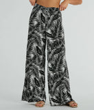 The Time For Vacay High Rise Tropical Palazzo Pants in black is a versatile pair of women's pants with trendy design accents, crafted for holiday-ready looks, from office wear to sophisticated winter night outs.