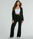 The Chic Confidence Buckle Accent Trouser Pants in black is a pair of women's pants with an on-trend leg style and elevated fabric that adds texture, perfect for crafting effortless winter outfits.