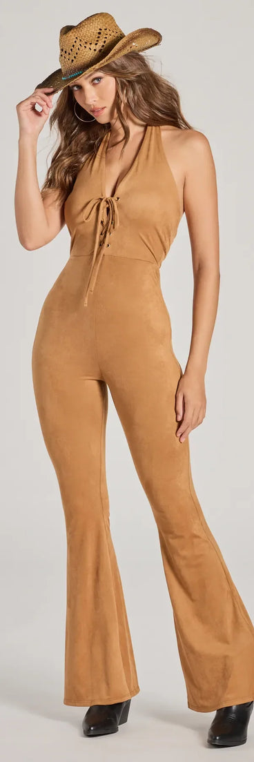 The Eyes On Me Lace-Up Flare Faux Suede Jumpsuit in camel is a women's jumpsuit with an on-trend leg style and elevated fabric that adds texture, perfect for crafting effortless winter outfits.