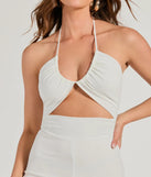 Create bold, fashion-forward looks for spring or summer with the Sultry Style Halter Cutout Wide-Leg Jumpsuit in ivory, a must-have piece from Windsor’s collection of stylish bottoms for women.