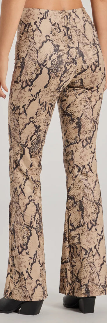 The Slither In Style High Rise Snake Print Flare Pants in taupe is a versatile pair of women's pants with trendy design accents, crafted for celebration-ready looks, from office wear to sophisticated winter night outs.