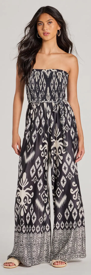 The Trendy Ease Strapless Boho Print Wide-Leg Jumpsuit in black is a women's jumpsuit with an on-trend leg style and elevated fabric that adds texture, perfect for crafting effortless winter outfits.