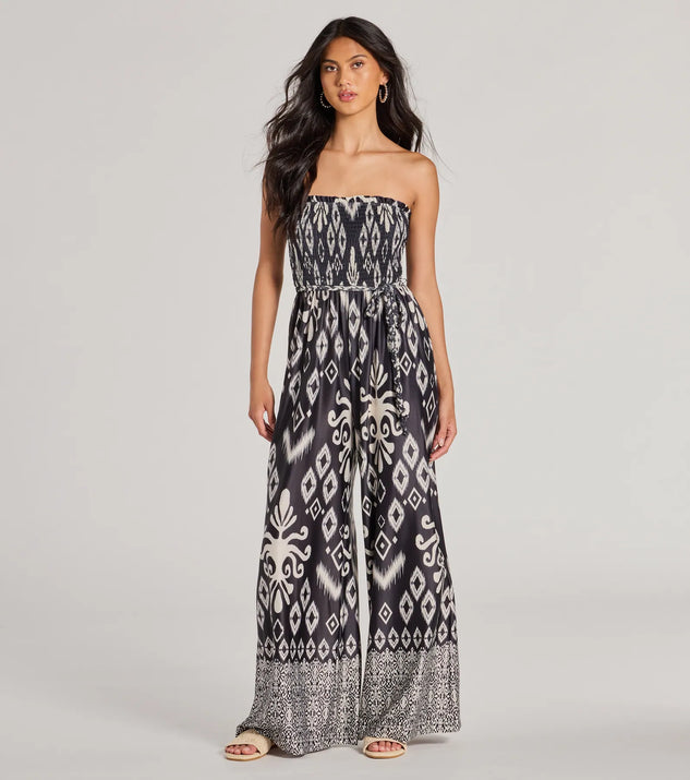 The Trendy Ease Strapless Boho Print Wide-Leg Jumpsuit in black is a women's jumpsuit with an on-trend leg style and elevated fabric that adds texture, perfect for crafting effortless winter outfits.