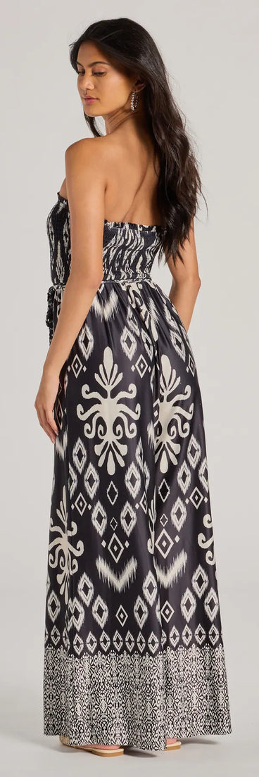 The Trendy Ease Strapless Boho Print Wide-Leg Jumpsuit in black is a versatile women's jumpsuit with trendy design accents, crafted for holiday-ready looks, from office wear to sophisticated winter night outs.