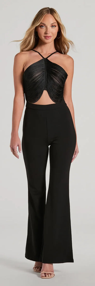 The Step Up Draped Fringe Halter Cutout Jumpsuit in black is a women's jumpsuit with an on-trend leg style and elevated fabric that adds texture, perfect for crafting effortless winter outfits.