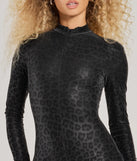 Step into seasonal style with the Feline Fatale Long Sleeve Catsuit, a women's black jumpsuit in a rich winter color, ideal for creating chic holiday party attire or a night-out look.