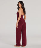 The Enticing Sass Halter Cutout Wide-Leg Jumpsuit is a trendy women's bottom in plum, designed with modern details and alluring textures to complete chic outfits for 2025.