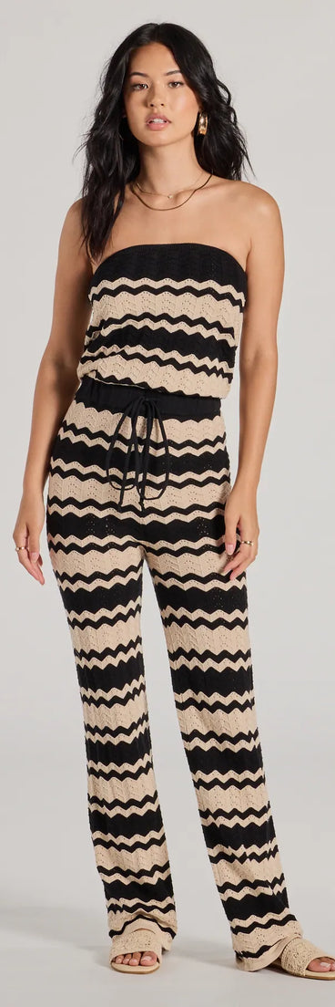 The Stylish In Stripes Strapless Wide Leg Knit Jumpsuit, a women's black jumpsuit, is a chic one-piece outfit for holiday parties and winter celebrations offering a glamorous look with festive style and on-trend design accents.