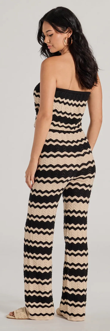 The Stylish In Stripes Strapless Wide Leg Knit Jumpsuit in black is a versatile women's jumpsuit with trendy design accents, crafted for holiday-ready looks, from office wear to sophisticated winter night outs.
