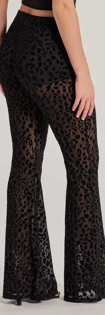 The Chic In The Wild Cheetah Print Flared Mesh Pants is a trendy women's bottom in black, designed with modern details and alluring textures to complete chic outfits for 2025.