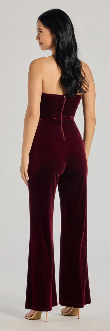 The The Glam Factor Sleeveless Velvet Jumpsuit is a trendy women's bottom in wine, designed with modern details and alluring textures to complete chic outfits for 2025.