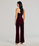 The The Glam Factor Sleeveless Velvet Jumpsuit is a trendy women's bottom in wine, designed with modern details and alluring textures to complete chic outfits for 2025.