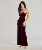 The The Glam Factor Sleeveless Velvet Jumpsuit is a trendy women's bottom in wine, designed with modern details and alluring textures to complete chic outfits for 2025.