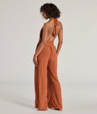 The Raise The Bar Wide-Leg Jumpsuit is a trendy women's bottom in rust, designed with modern details and alluring textures to complete chic outfits for 2025.