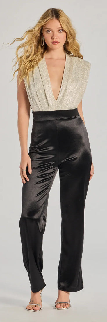 Create bold, fashion-forward looks for spring or summer with the Radiant Era Glitter Lurex And Satin Jumpsuit in black, a must-have piece from Windsor’s collection of stylish bottoms for women.