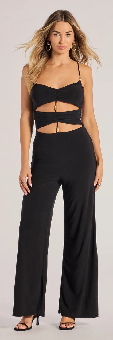 The Double Take Wide-Leg Cutout Jumpsuit, a women's black jumpsuit, is a chic one-piece outfit for parties and celebrations offering a glamorous look with festive style and on-trend design accents.