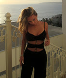 The Double Take Wide-Leg Cutout Jumpsuit is a trendy women's bottom in black, designed with modern details and alluring textures to complete chic outfits for 2025.
