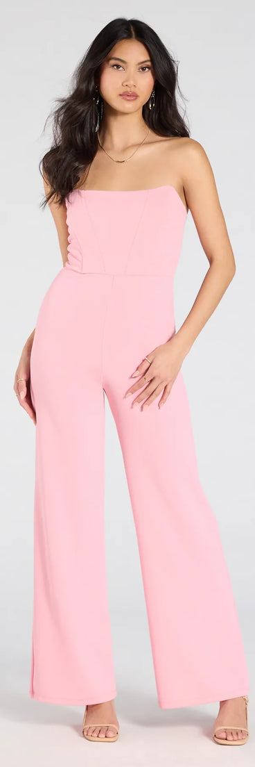 Create bold, fashion-forward looks for summer with the Sultry Babe Strapless Corset Wide-Leg Jumpsuit in pink, a must-have piece from Windsor’s collection of stylish bottoms for women.