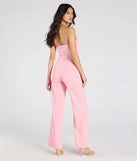 Create bold, fashion-forward looks for spring or summer with the Sultry Babe Strapless Corset Wide-Leg Jumpsuit in pink, a must-have piece from Windsor’s collection of stylish bottoms for women.