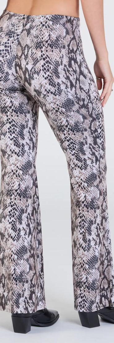 Stay polished and comfortable in the Slithering Impression Snake Print Sequin Flare Pants, trendy snake print pants for women that transition from everyday looks to weekend slay.