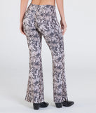 Create bold, fashion-forward looks for spring or summer with the Slithering Impression Snake Print Sequin Flare Pants in snake print, a must-have piece from Windsor’s collection of stylish bottoms for women.