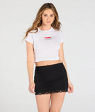 Create bold, fashion-forward looks for spring or summer with the Hint Of Romance Lace Trim Mini Skort in black, a must-have piece from Windsor’s collection of stylish bottoms for women.