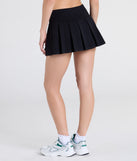 With a flirty cut and hidden shorts underneath, the School's Out High-Rise Pleated Ponte Skort in ivory serves skirt vibes with zero wardrobe worries.