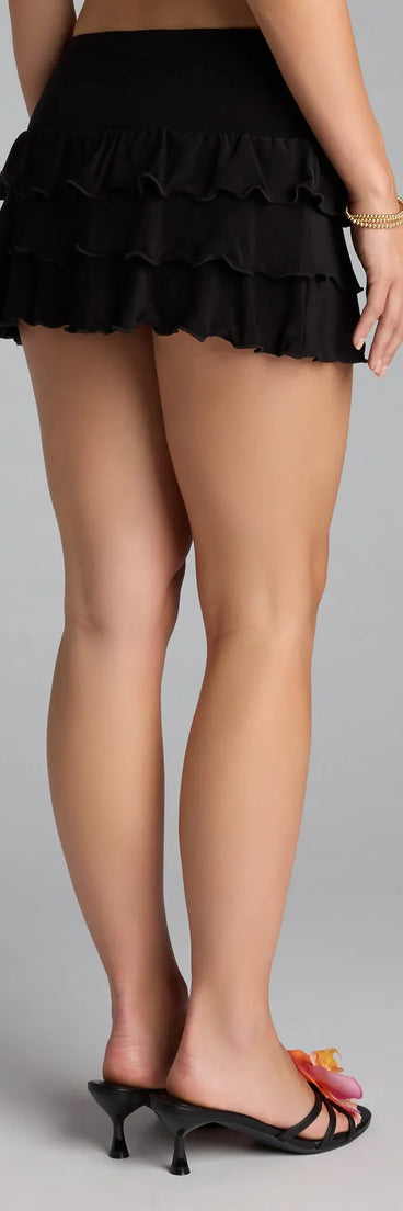 Style up your rotation with the Sensational Match Ruffle Mini Skort, a trendy black skort made to anchor every outfit with attitude and ease.