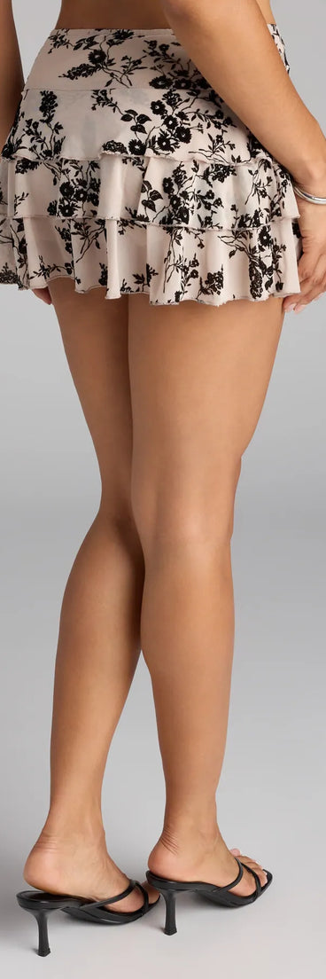 Make a fall statement in ivory tones that highlight the Ruffle Agenda Floral Mesh Skort as a must-have among fall bottoms for women.