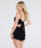 Create bold, fashion-forward looks for spring or summer with the One Take V-Neck Ruffle Skater Romper in black, a must-have piece from Windsor’s collection of stylish bottoms for women.