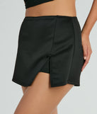 Create bold, fashion-forward looks for spring or summer with the Significant Strut Mid-Rise Bow Slit Skort in black, a must-have piece from Windsor’s collection of stylish bottoms for women.