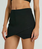 The Always A Sensation High-Rise Ponte Skort in black is a women's workwear piece offering a trendy style and unique accents, perfect for effortlessly creating an outfit-of-the-day look that transitions your office look to going-out ready.